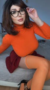 Miss Donatella as Velma Dinkley from Scooby Doo