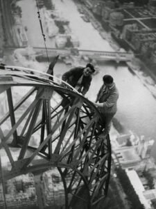 Two electricians working the Eiffel Tower, circa 1937.